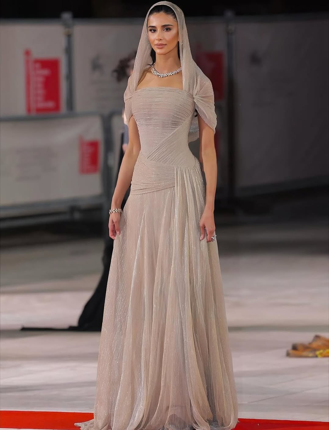 Rahaf Alharbi on the Red Carpet looking stunning in a champagne-gold couture gown